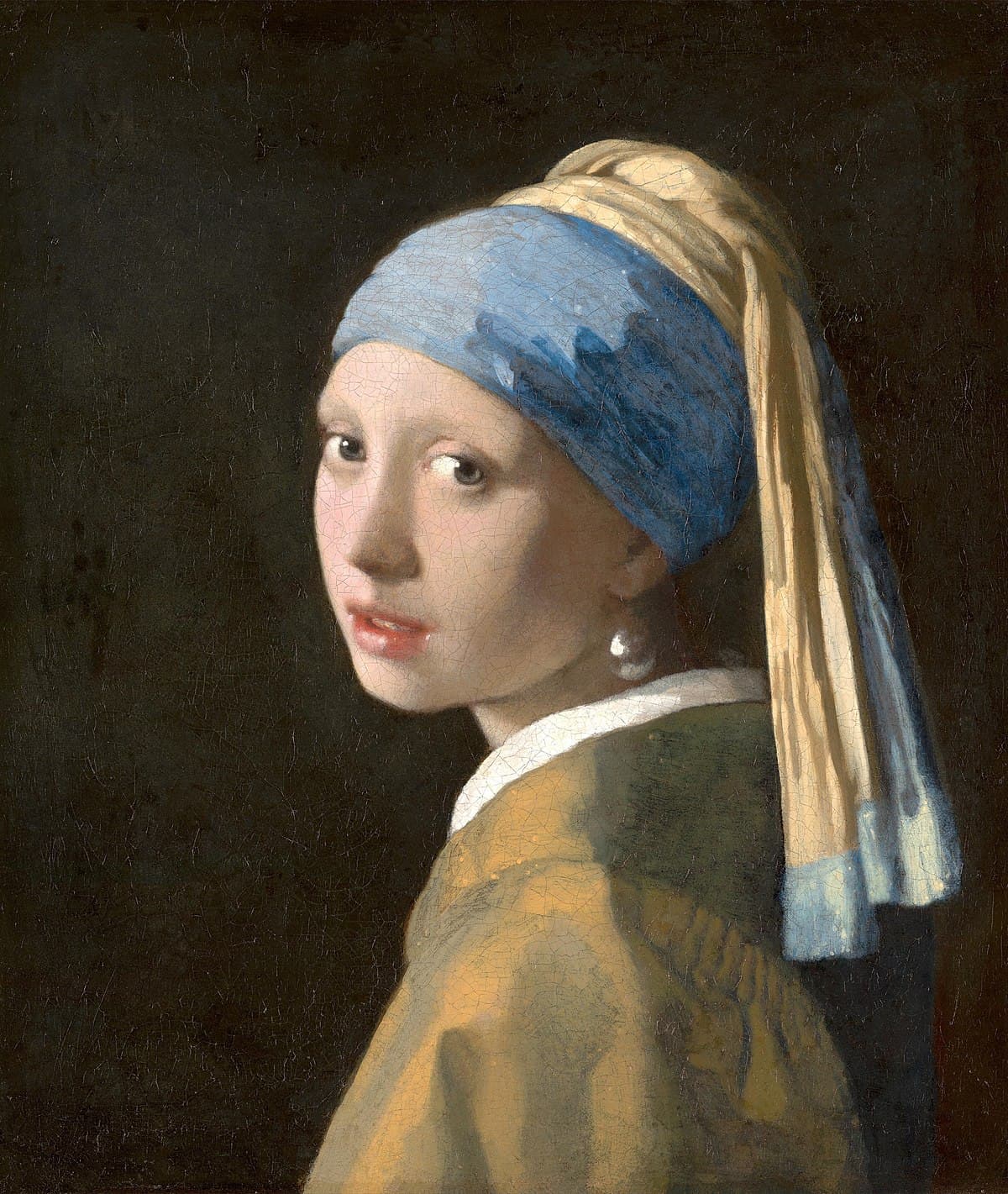 Girl with a Pearl Earring by Johannes Vermeer, showing a young woman in a turban gazing over her shoulder.