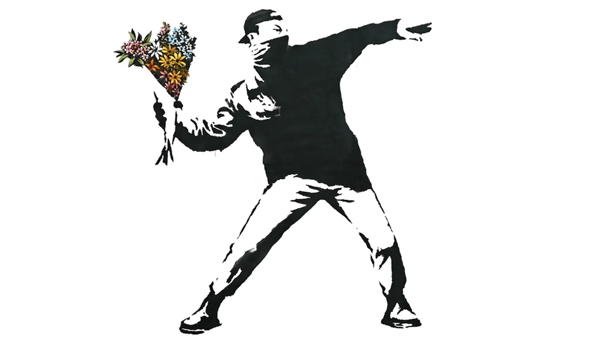 A Banksy mural of a girl letting go of a red heart-shaped balloon on a concrete wall