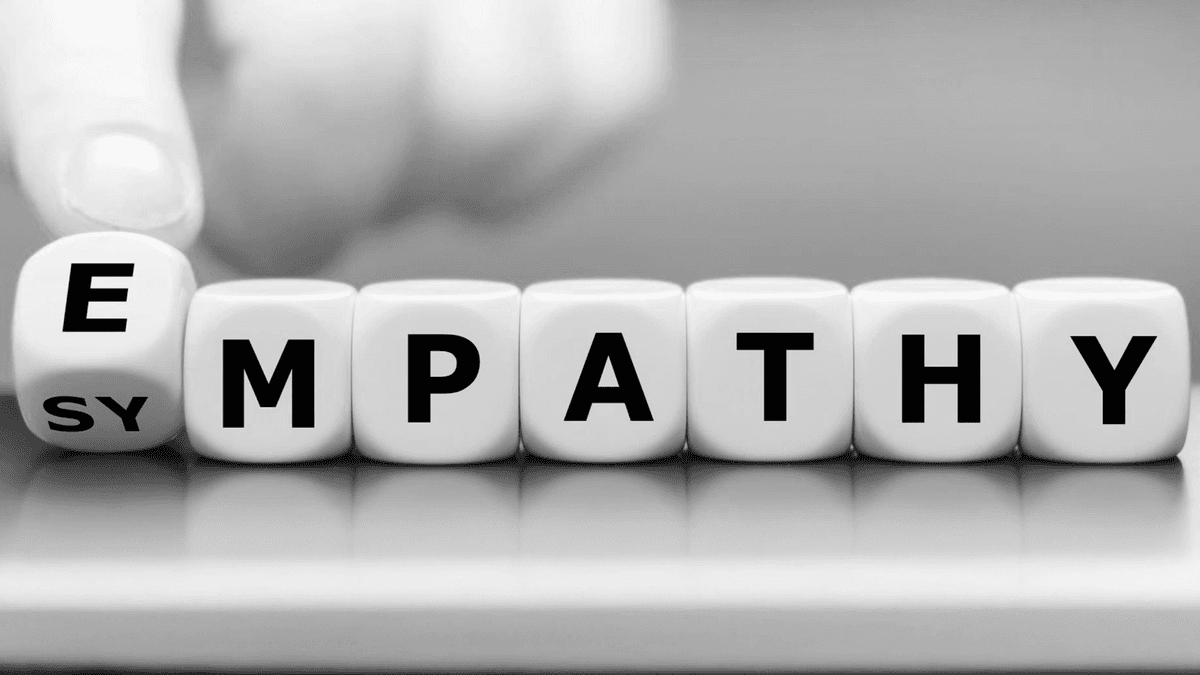 Two people sitting together, one listening attentively while the other talks with emotion.