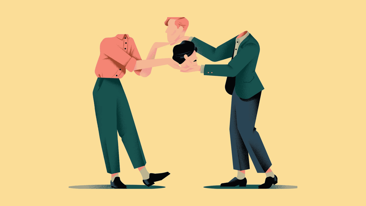 Two kids talking while sitting on a park bench, one offering a listening ear.