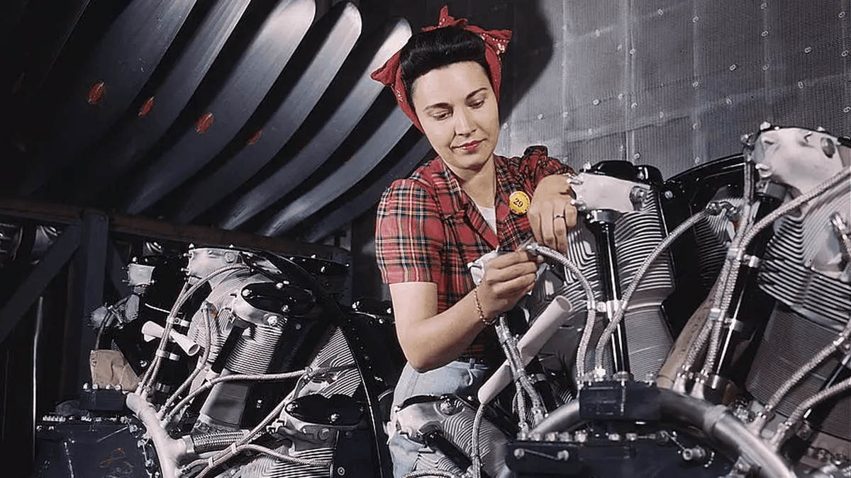 American factory workers building planes during World War II