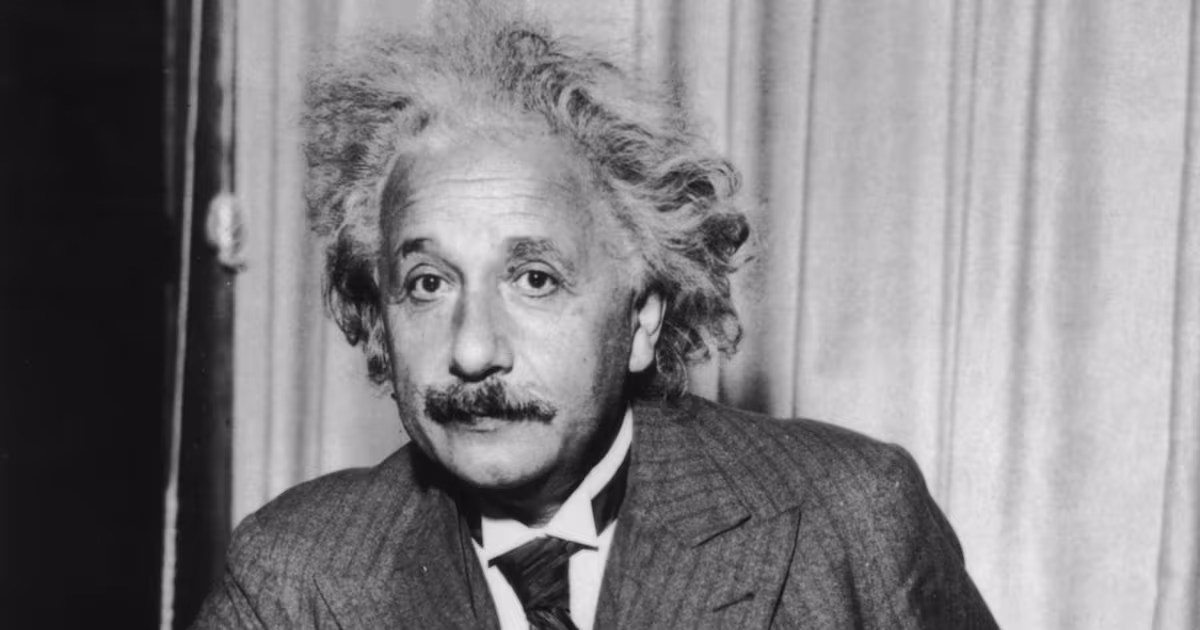 Albert Einstein with his signature wild hair and a gentle, thoughtful expression