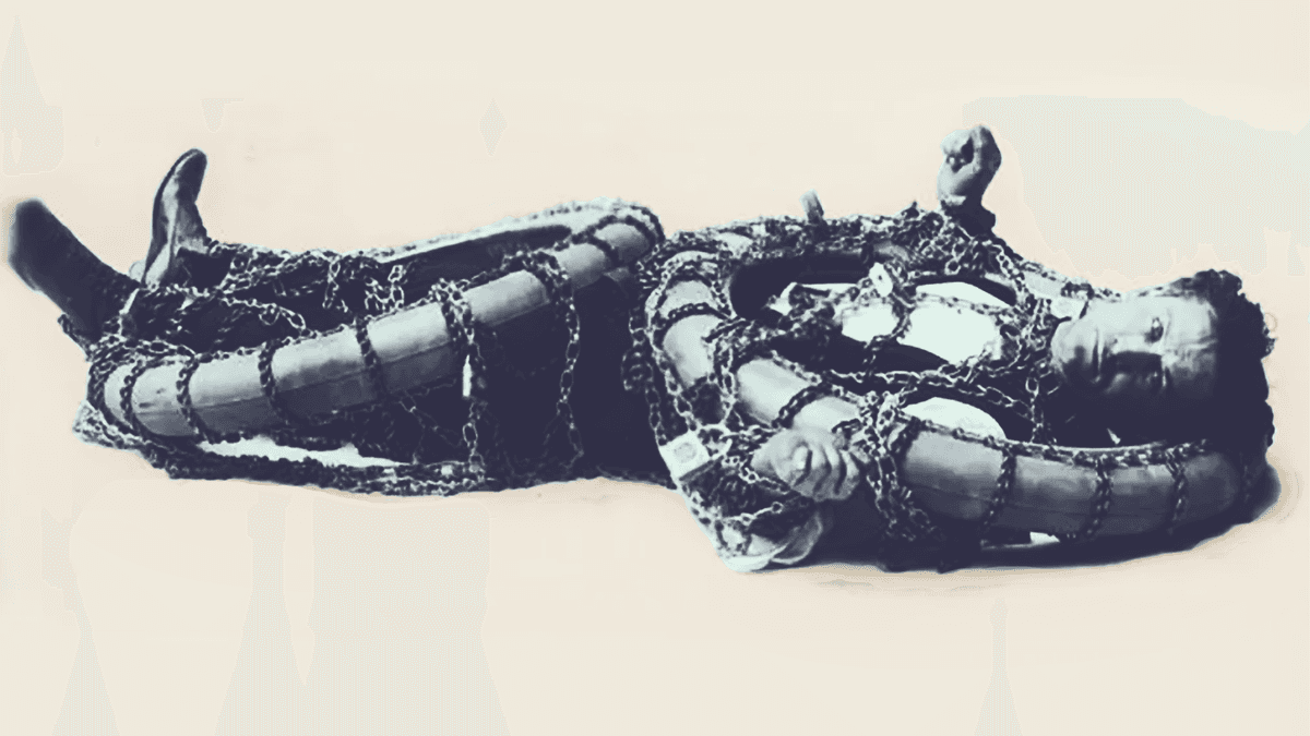 Harry Houdini performing an escape stunt